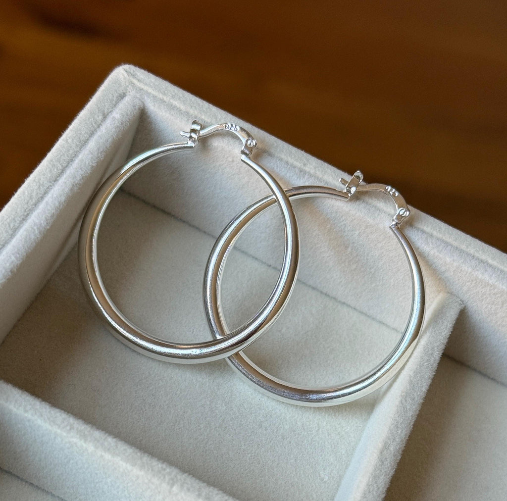 Another angle of the 40mm silver hoop earrings