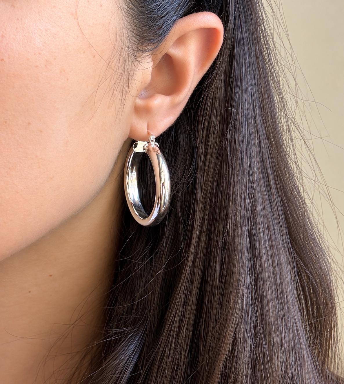 35mm chunky polished sterling silver hoop earring worn on the ear