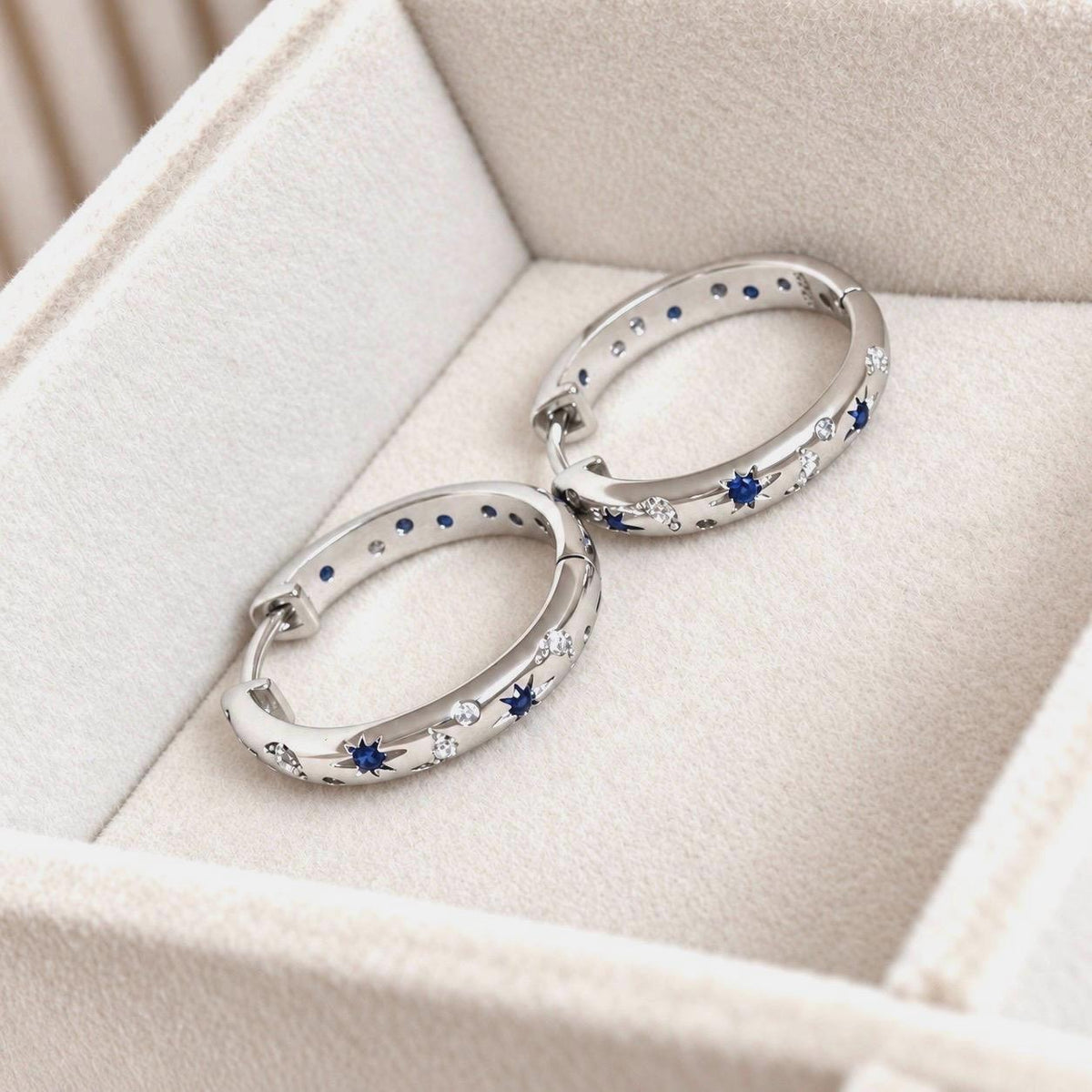 Silver celestial CZ hoop earrings on Kamíli Accessories jewellery card