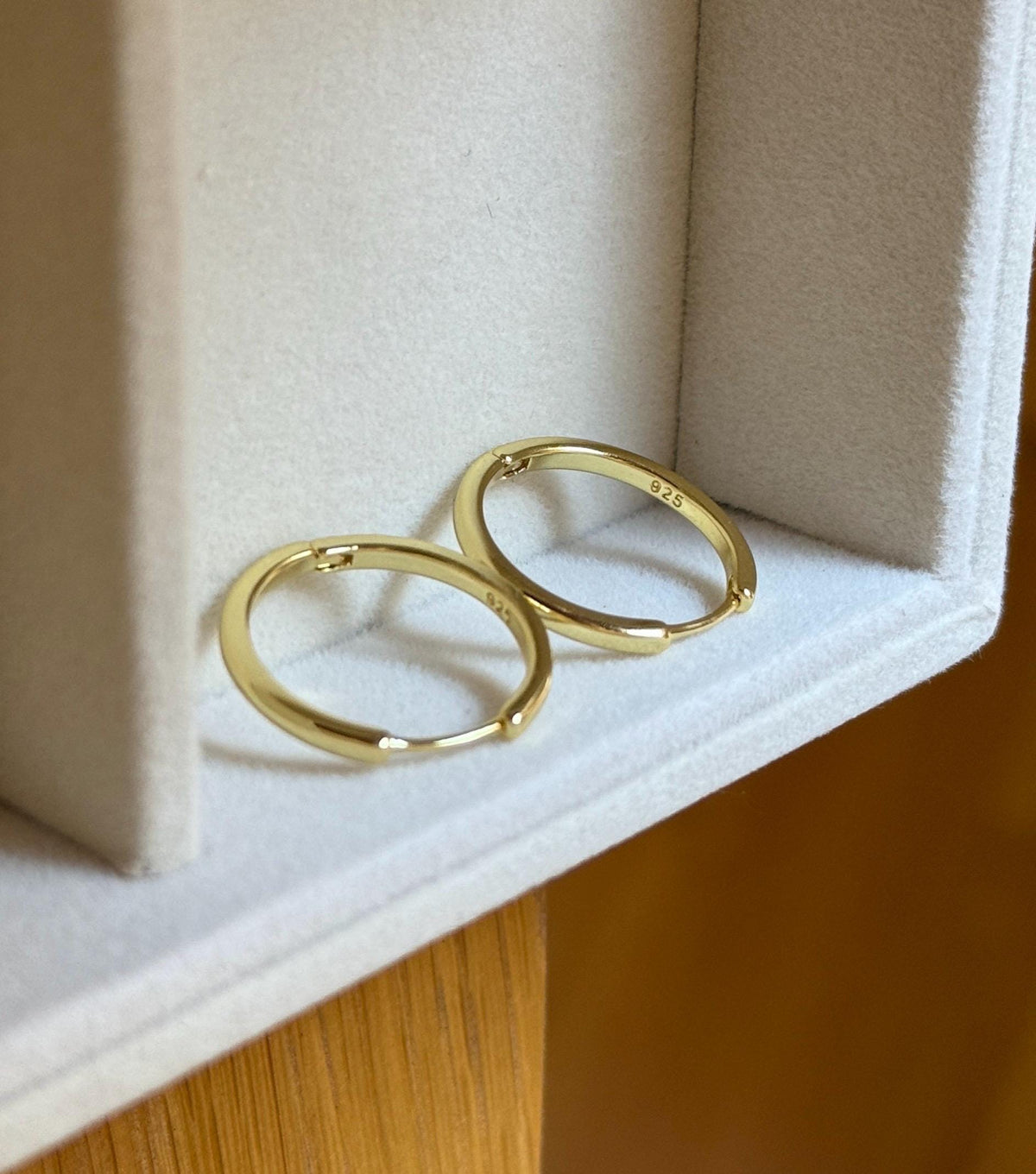 Inside view of gold plated sterling silver hoop earrings showing 925 stamp