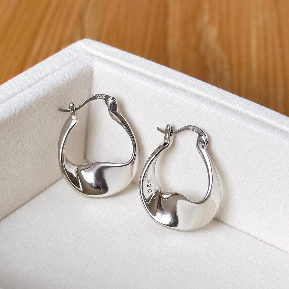 925 sterling silver sculptural twisted teardrop hoop earrings in white velvet jewellery box