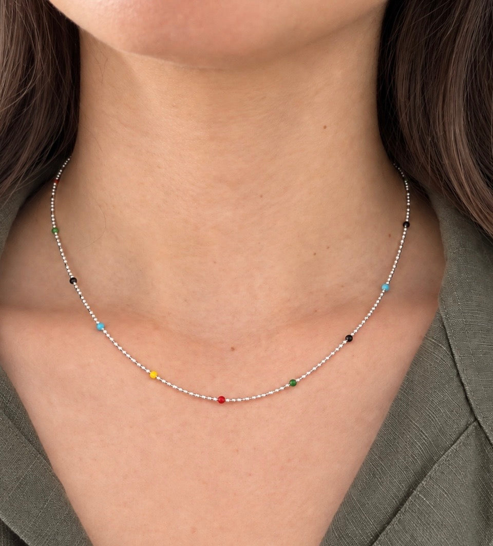 Dainty colourful 925 sterling silver beaded necklace shown worn around neck