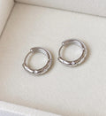 925 sterling silver star engraved cubic zirconia hoop earrings, front close-up