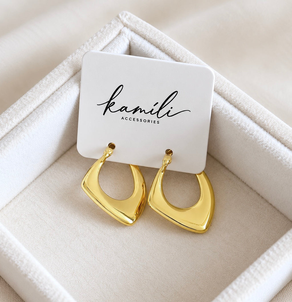 Gold geometric hoop earrings displayed on Kamili Accessories jewellery card