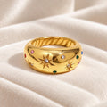 Gold starburst CZ dome ring showing multicoloured stones