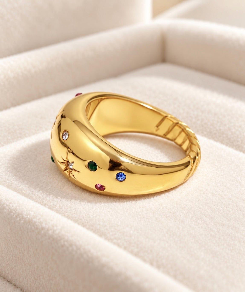 Side profile of gold-plated chunky ring with colourful CZ details