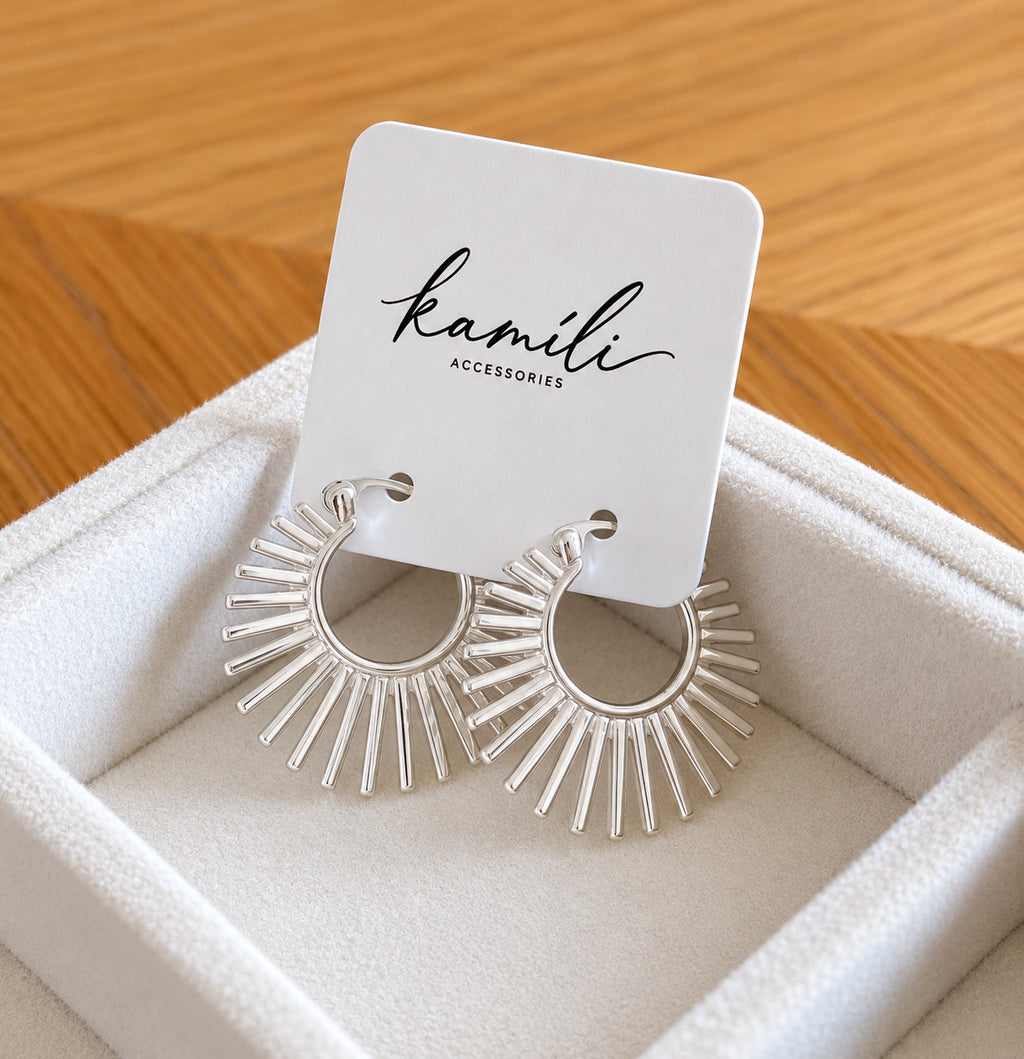 Sunburst earrings on Kamíli Accessories card angled view